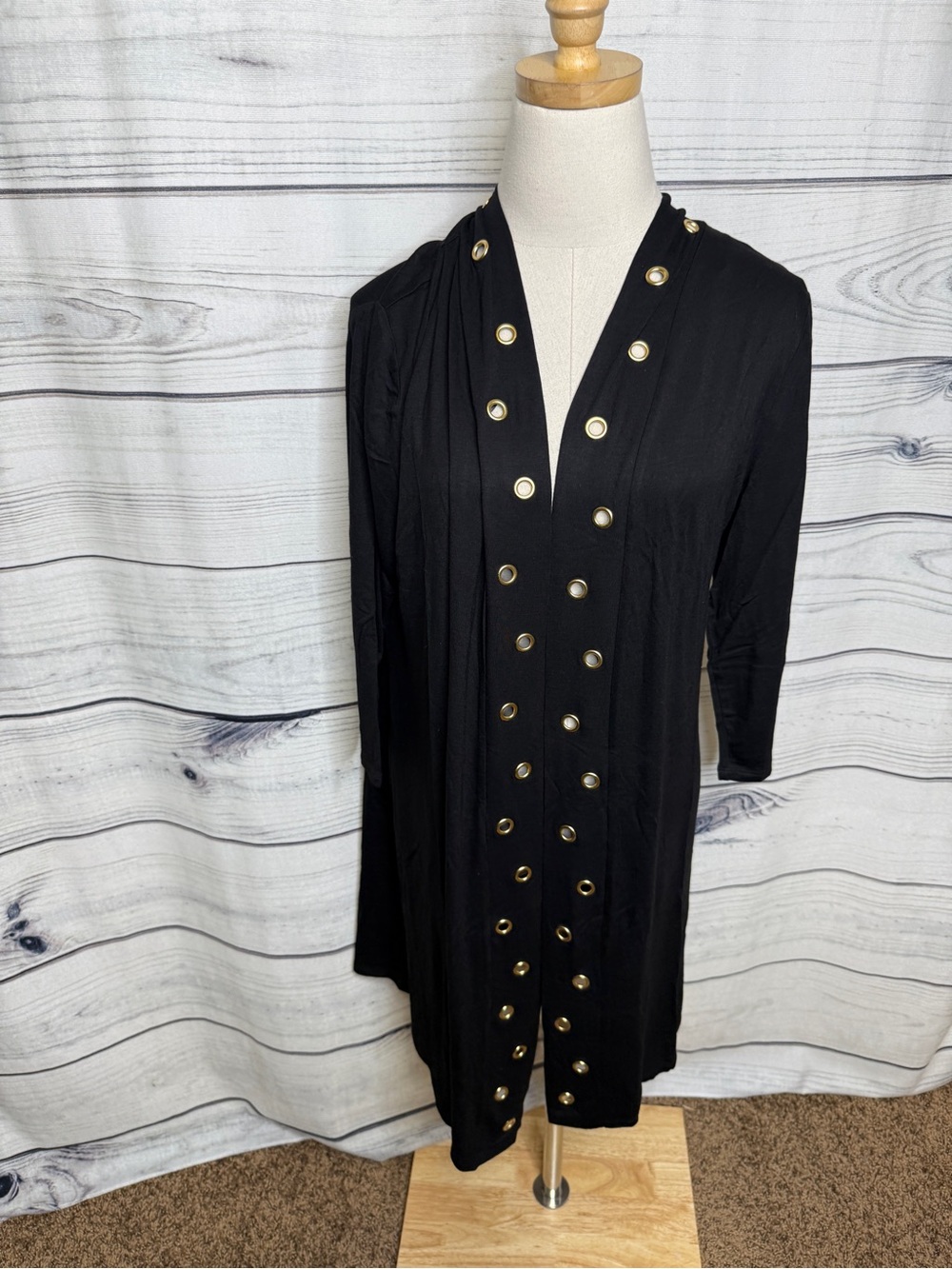 Black open front top with brass grommet accents